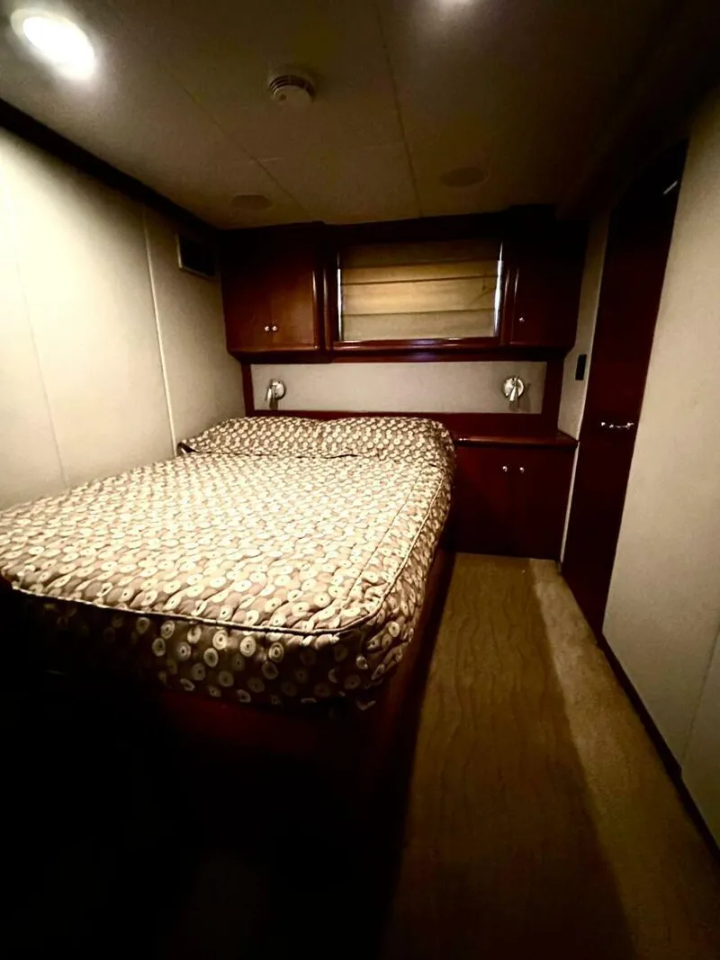 Slide: The Image of Cozy bedroom in 2001 Dovercraft Custom RPH yacht with elegant wood finishes. - 29