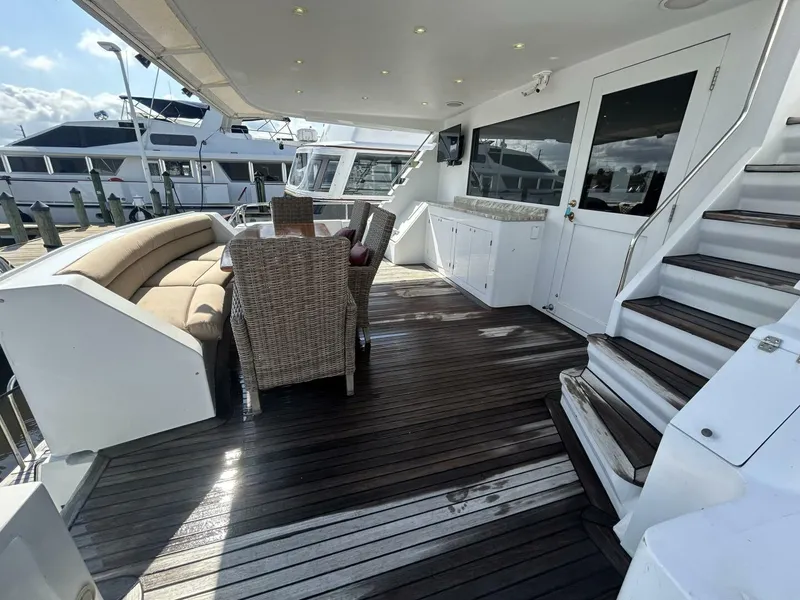 Slide: The Image of Spacious deck of 2001 Dovercraft Custom RPH yacht with seating and dining area. - 32