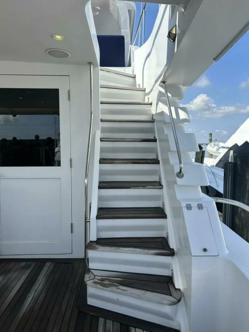 Slide: The Image of Staircase on 2001 Dovercraft Custom RPH yacht, leading to upper deck under clear sky. - 34