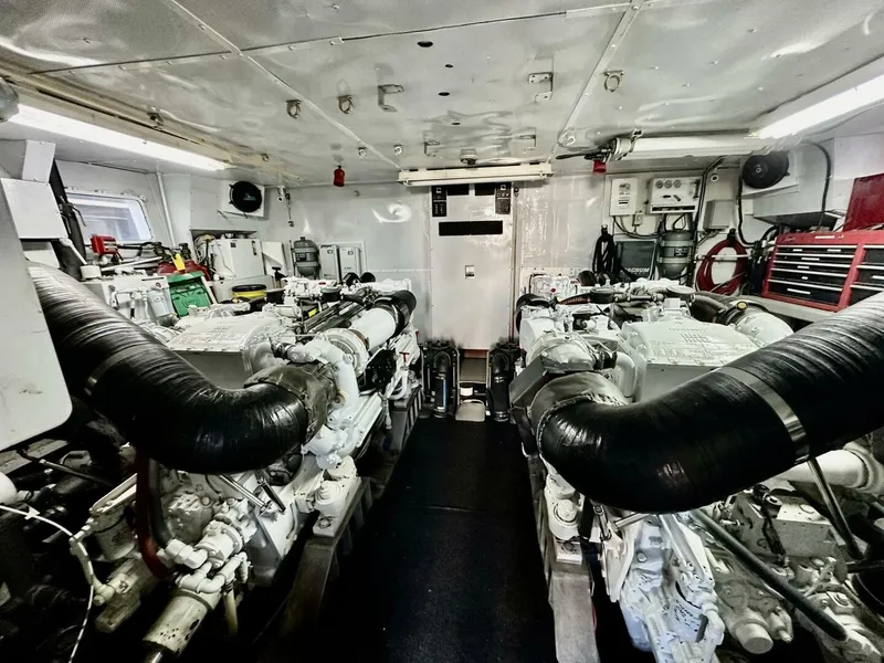 Slide: The Image of Engine room of 2001 Dovercraft Custom RPH yacht, featuring dual engines and mechanical equipment. - 48