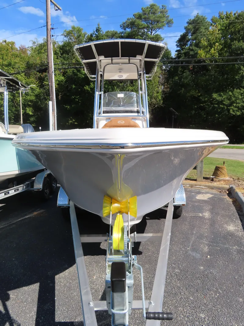 Slide: The Image of 2025 Key West 203 FS boat on trailer, parked outdoors. - 2