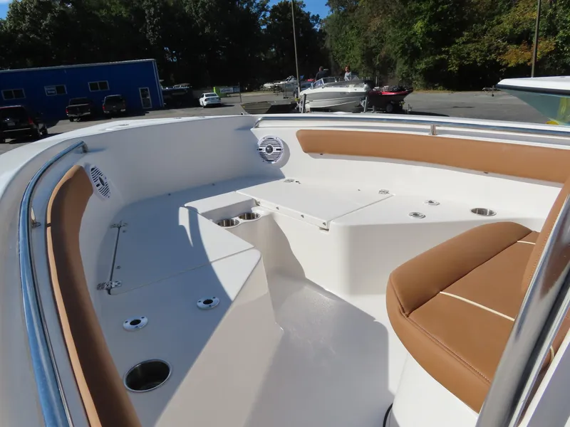 Slide: The Image of 2025 Key West 203 FS boat interior with tan seating and white deck. - 6