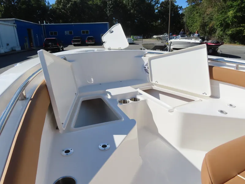 Slide: The Image of 2025 Key West 203 FS boat interior with open storage compartments. - 7