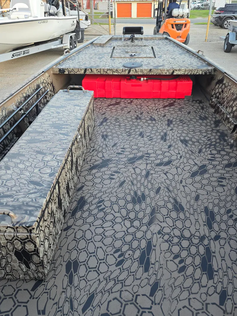 Slide: The Image of 2025 Pro-Drive SBX Series TD boat with camouflage interior design. - 11