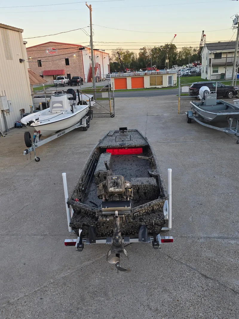 Slide: The Image of 2025 Pro-Drive SBX Series TD boat on trailer in outdoor lot. - 7