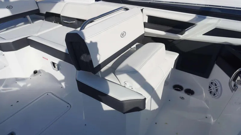 Slide: The Image of 2025 Cobalt R6 boat interior with white and black seating, modern design. - 10