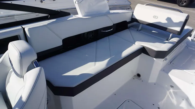 Slide: The Image of 2025 Cobalt R6 boat interior with white leather seating and modern design. - 11