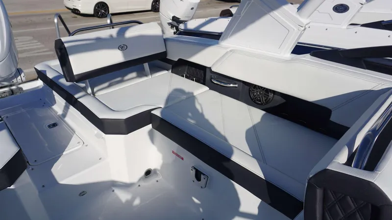 Slide: The Image of 2025 Cobalt R6 boat interior with white seating and modern design. - 12