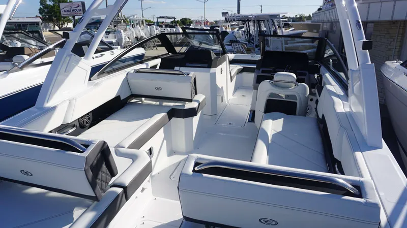 Slide: The Image of 2025 Cobalt R6 boat interior with sleek white seating and modern design. - 5
