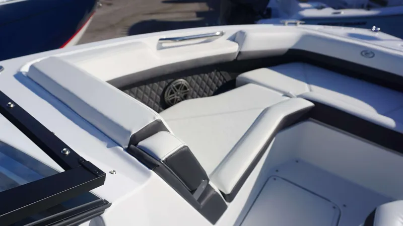 Slide: The Image of 2025 Cobalt R6 boat interior with white cushioned seating and speaker detail. - 7