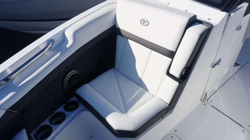 Slide: The Image of Luxurious seating on 2025 Cobalt R6 boat with cup holders and speaker. - 8