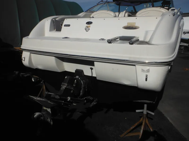 Slide: The Image of 2004 Sea Ray 215 Weekender boat on stands, rear view. - 10