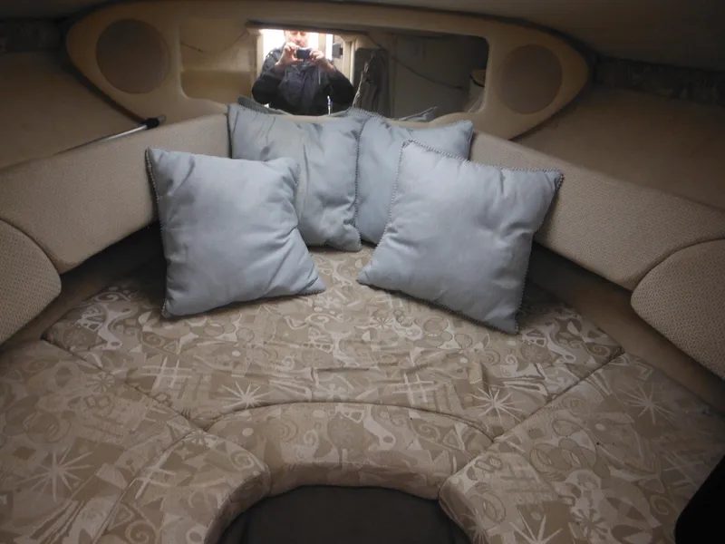 Slide: The Image of Interior cabin of 2004 Sea Ray 215 Weekender with cushions and patterned upholstery. - 27