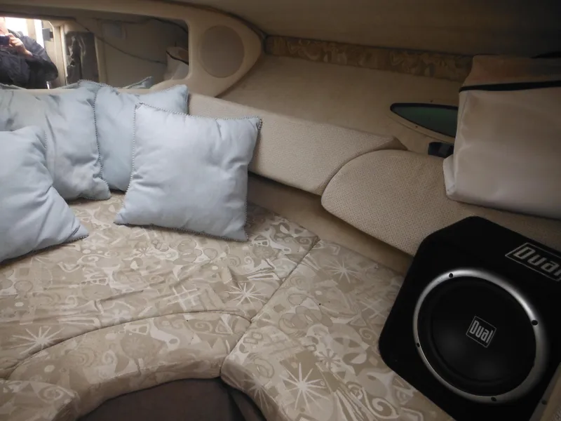 Slide: The Image of Interior of 2004 Sea Ray 215 Weekender with cushions and speaker. - 29