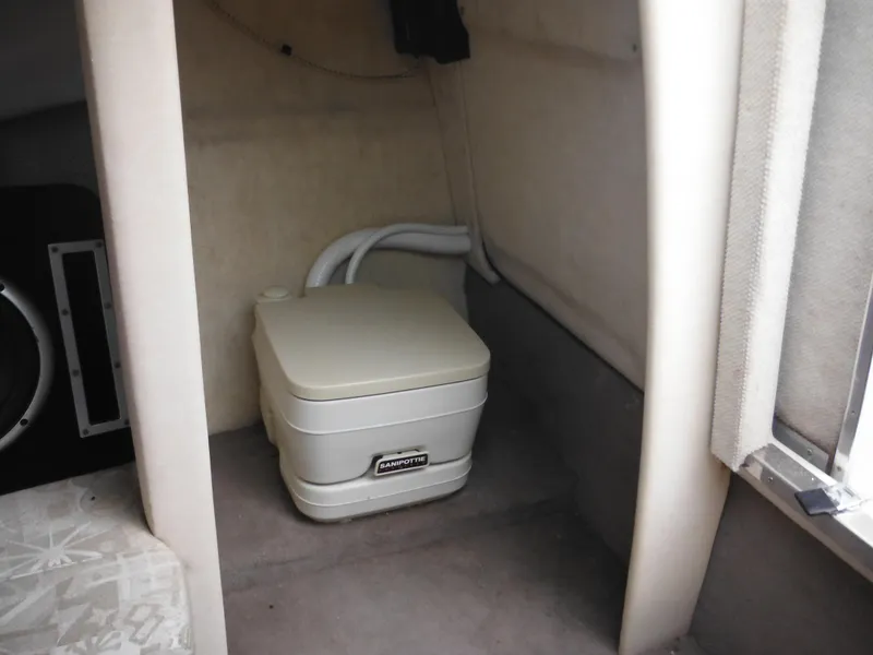 Slide: The Image of 2004 Sea Ray 215 Weekender cabin with portable toilet. - 31