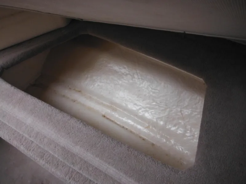 Slide: The Image of Interior storage compartment of 2004 Sea Ray 215 Weekender boat. - 35