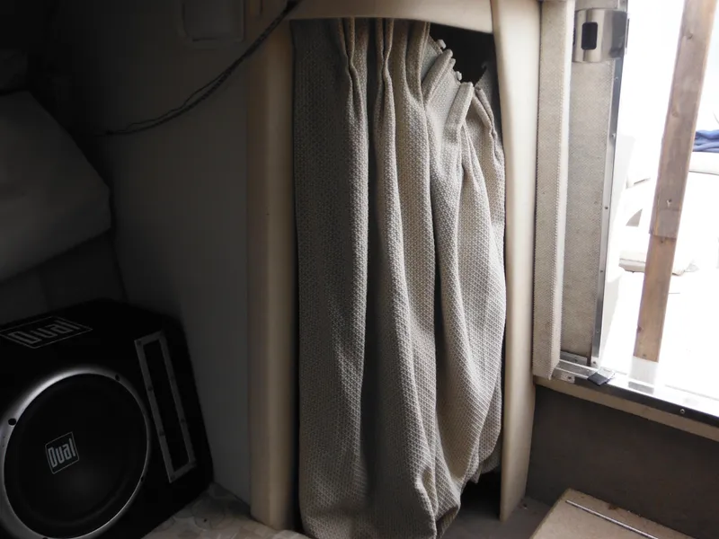 Slide: The Image of Interior of 2004 Sea Ray 215 Weekender with curtain and speaker. - 37