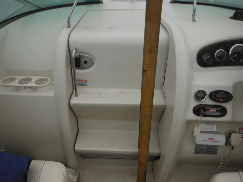 Slide: The Image of 2004 Sea Ray 215 Weekender boat interior with dashboard and steps. - 39