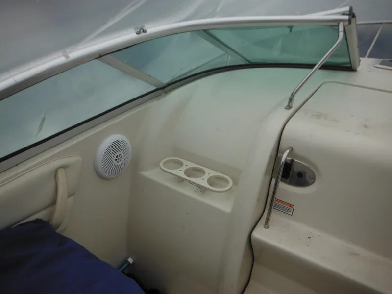 Slide: The Image of Interior view of 2004 Sea Ray 215 Weekender boat with cup holders and speaker. - 40
