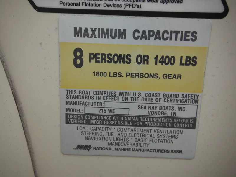 Slide: The Image of Sea Ray 215 Weekender 2004 capacity label: 8 persons or 1400 lbs, 1800 lbs with gear. - 49