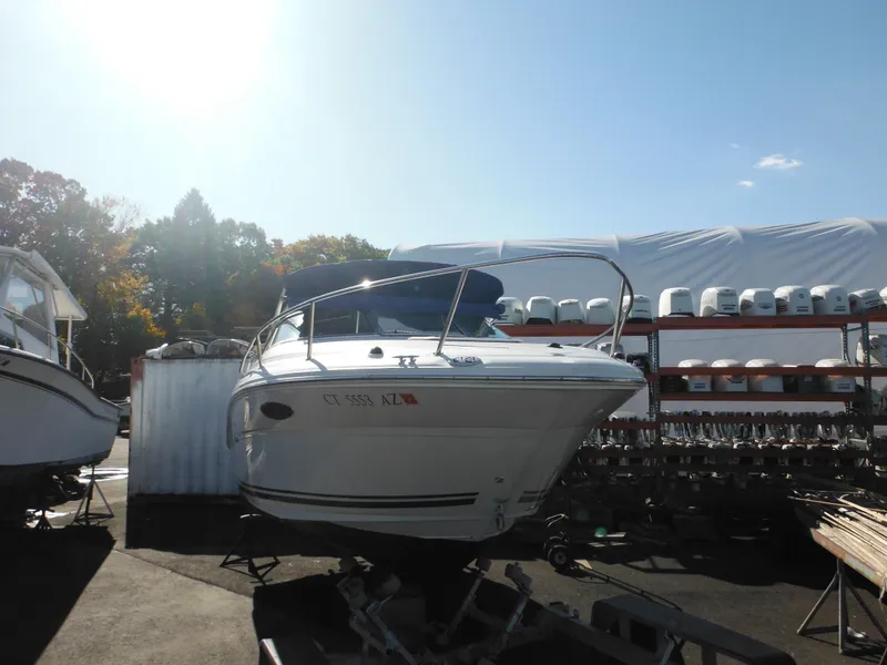 Slide: The Image of 2004 Sea Ray 215 Weekender boat on trailer in storage yard. - 5