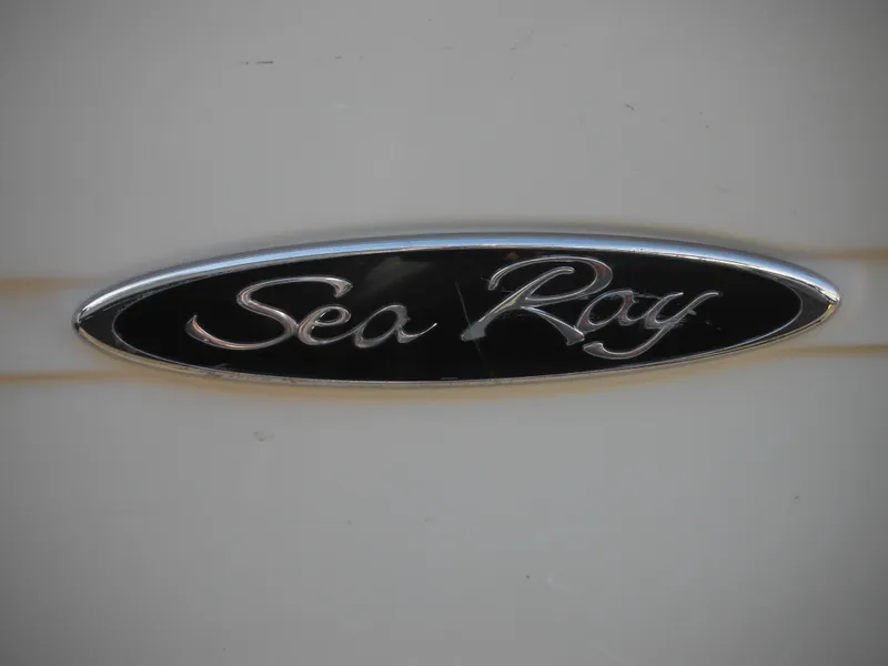 Slide: The Image of 2004 Sea Ray 215 Weekender logo on boat exterior. - 8