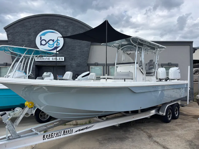 The Image of 2025 KenCraft 269 boat on trailer at marine sales dealership. - 1