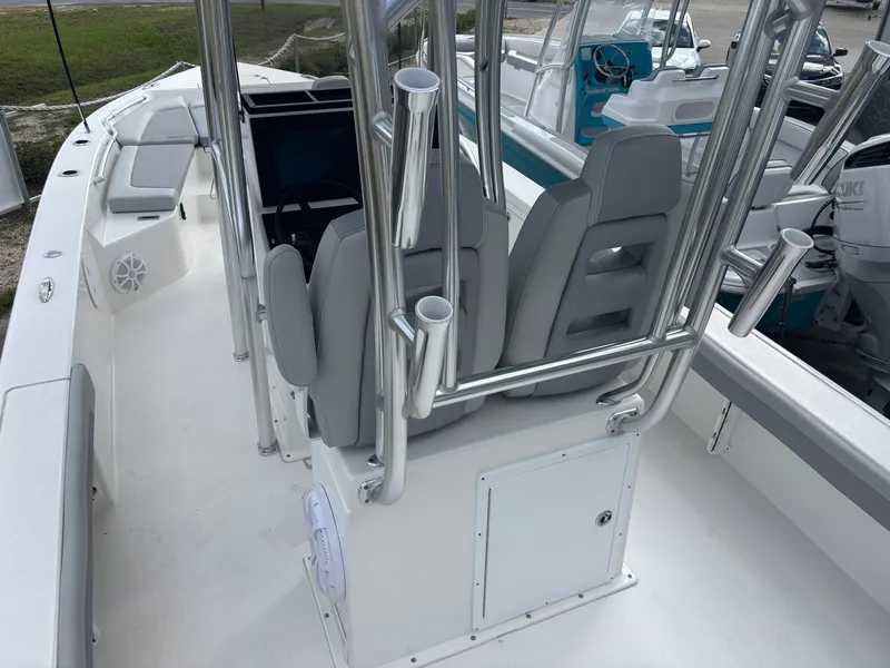 Slide: The Image of 2025 KenCraft 269 boat deck with storage compartment and rod holders. - 13
