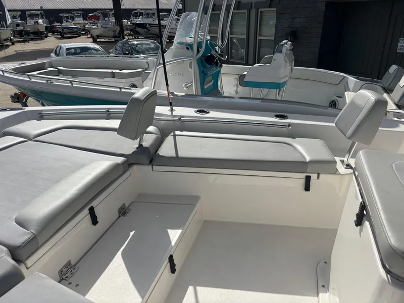 Slide: The Image of 2025 KenCraft 269 boat with sleek design and spacious interior, featuring a sunshade canopy. - 14