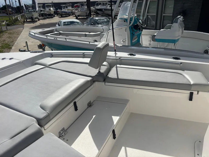 Slide: The Image of 2025 KenCraft 269 boat interior with cushioned seating and storage compartments. - 15