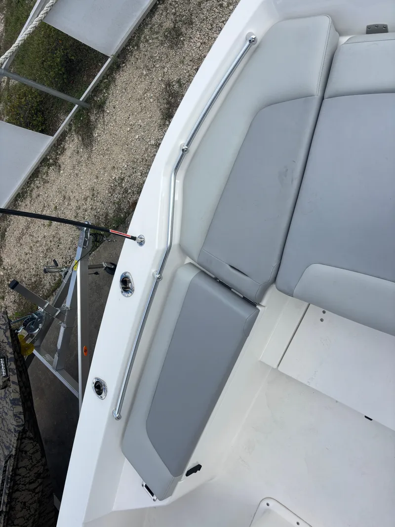 Slide: The Image of 2025 KenCraft 269 boat interior with gray seating and sleek design. - 17