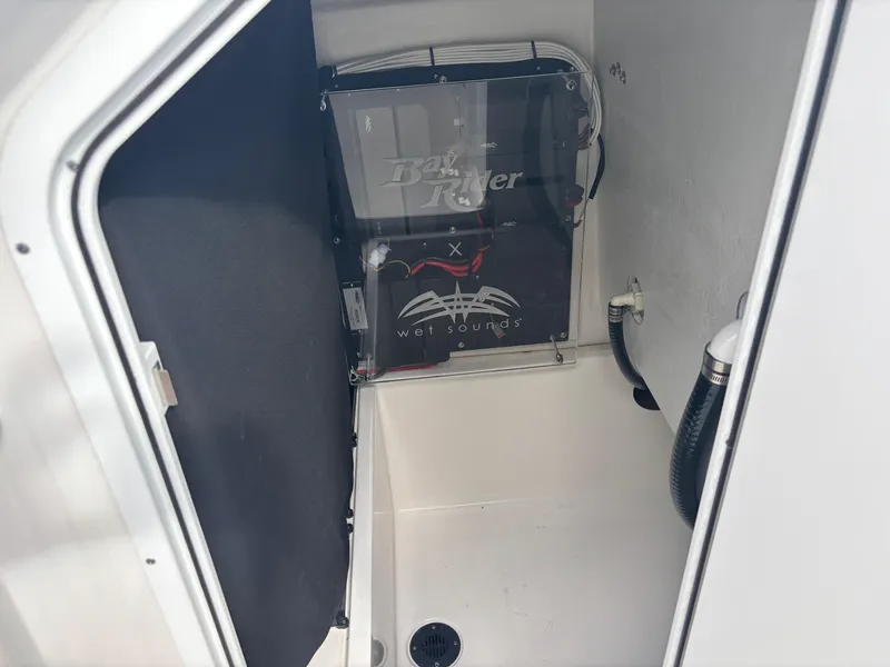 Slide: The Image of Interior view of a 2025 KenCraft 269 boat compartment with visible equipment. - 20