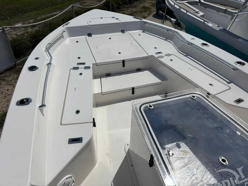 Slide: The Image of 2025 KenCraft 269 boat, white deck, center console, modern design, outdoor setting. - 24