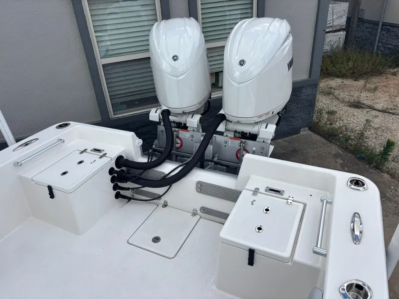 Slide: The Image of 2025 KenCraft 269 boat deck with storage compartments and stainless steel railings. - 27