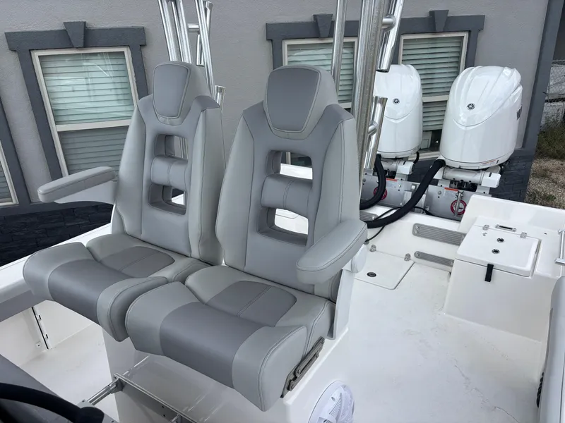 Slide: The Image of 2025 KenCraft 269 boat deck with storage compartments and railing. - 28