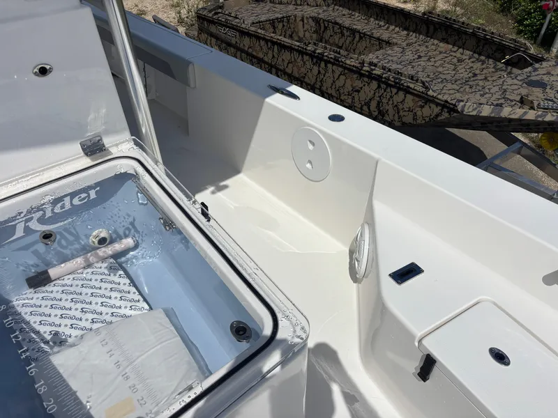 Slide: The Image of KenCraft 269 boat interior, 2025 model, featuring storage compartments and sleek design. - 31