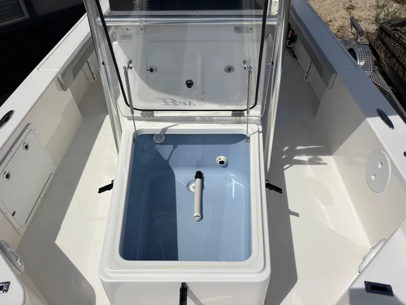 Slide: The Image of 2025 KenCraft 269 boat with open storage compartment and sleek design. - 34