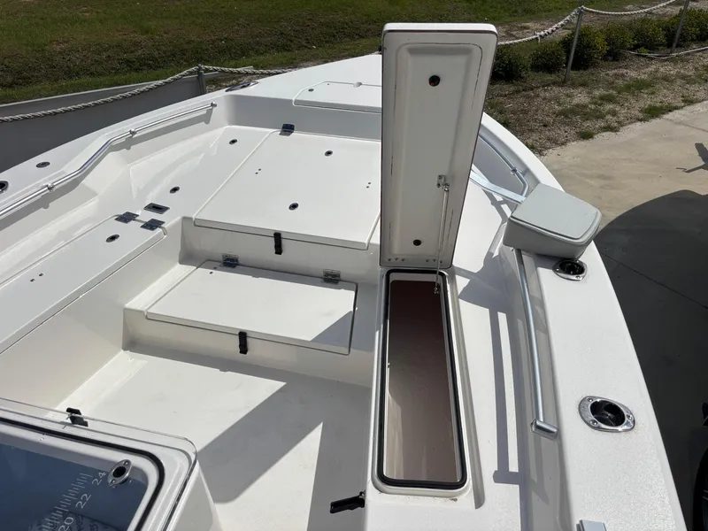 Slide: The Image of 2025 KenCraft 269 boat deck with open storage compartments and seating. - 35