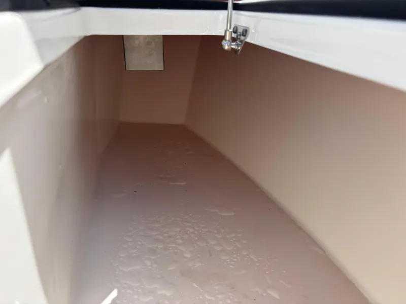 Slide: The Image of Interior storage compartment of 2025 KenCraft 269 boat, featuring a clean, spacious design. - 36