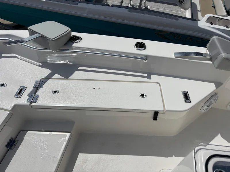 Slide: The Image of KenCraft 269 boat deck, 2025 model, featuring storage compartments and seating area. - 38