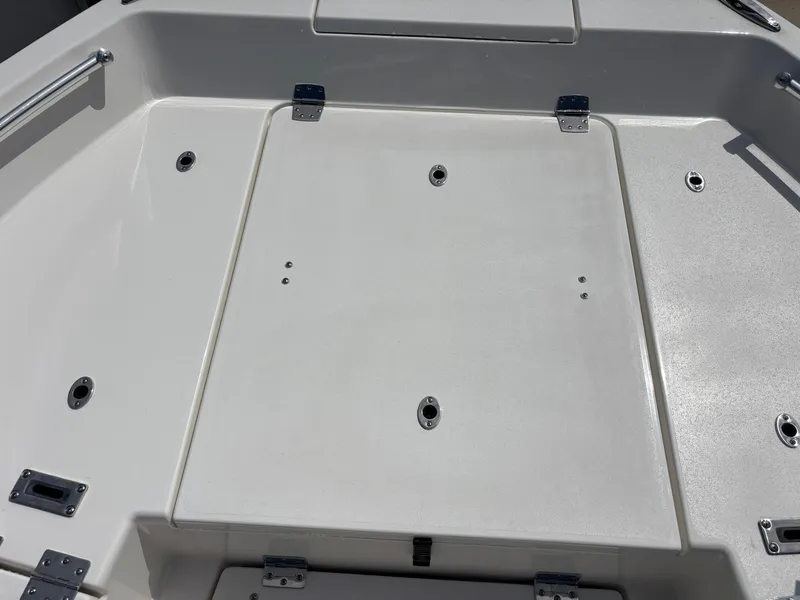 Slide: The Image of 2025 KenCraft 269 boat deck with storage compartments and metal fixtures. - 41