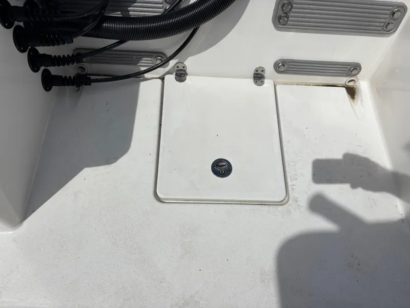 Slide: The Image of KenCraft 269 boat deck, 2025 model, featuring a hatch and cable management. - 45