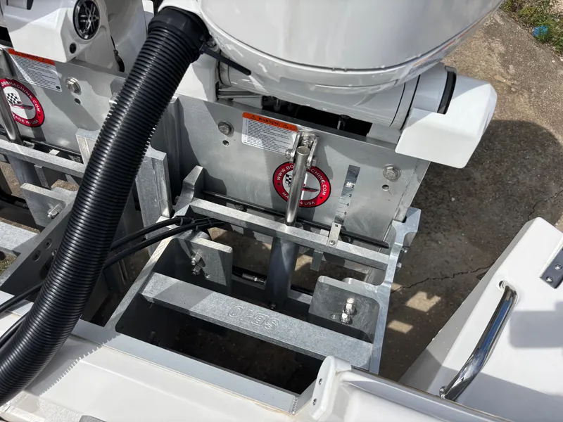 Slide: The Image of 2025 KenCraft 269 boat engine mount with cables and metal components. - 49