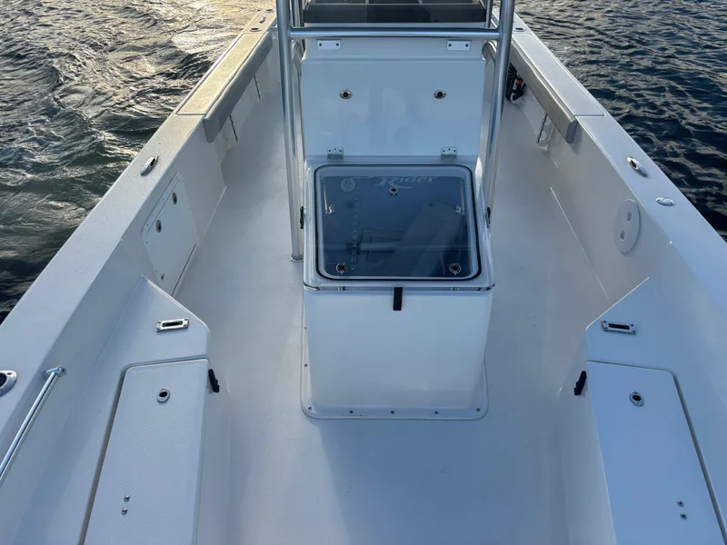 Slide: The Image of 2025 KenCraft 269 boat interior with center console on calm water. - 6
