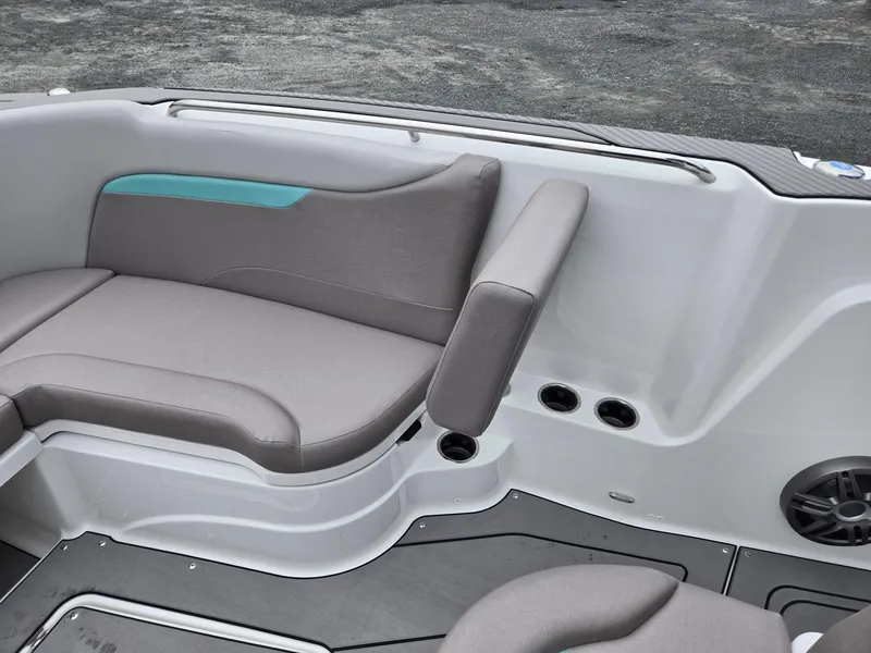 Slide: The Image of 2025 Hurricane Center Console 24 OB boat interior with gray seating and teal accent. - 12