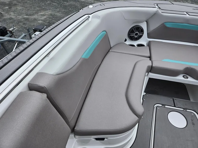 Slide: The Image of 2025 Hurricane Center Console 24 OB boat interior with gray seating and teal accents. - 14
