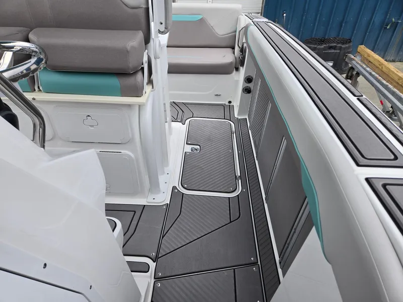 Slide: The Image of 2025 Hurricane Center Console 24 OB boat interior with sleek seating and modern design. - 15