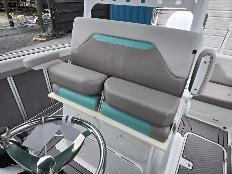Slide: The Image of 2025 Hurricane Center Console 24 OB boat interior with modern seating and steering wheel. - 16