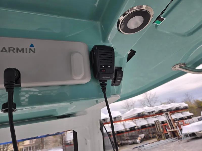 Slide: The Image of 2025 Hurricane Center Console 24 OB boat with Garmin equipment and communication device. - 22