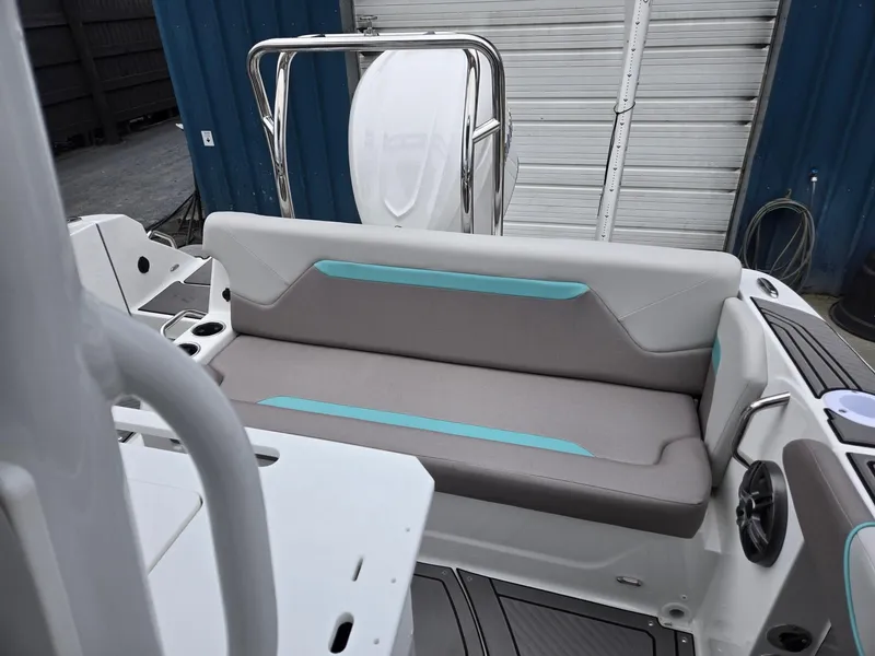 Slide: The Image of 2025 Hurricane Center Console 24 OB boat interior with cushioned seating and modern design. - 23